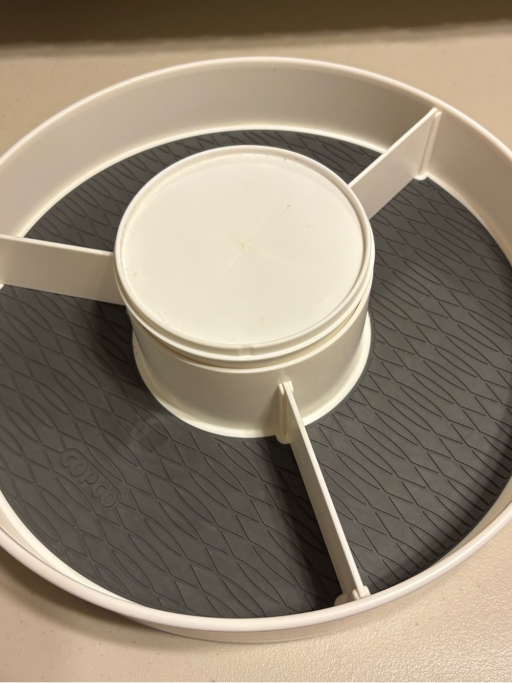 White Rotating Organizer Tray with Gray Non-Slip Base used
